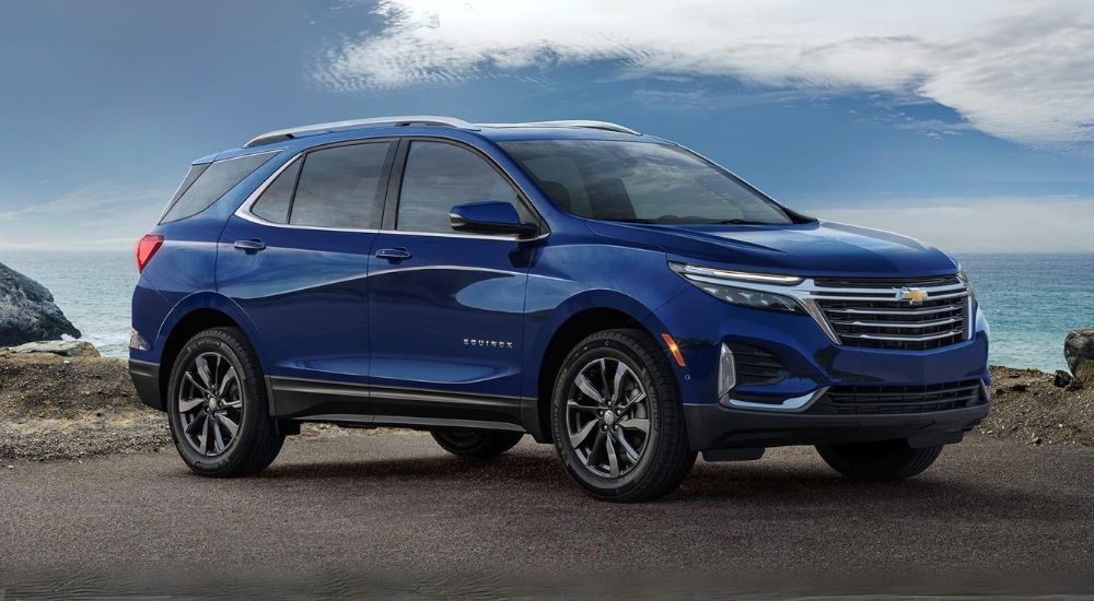 blue 2022 Chevy Equinox Premier is shown from the side while parked after leaving a New Albany Chevy dealer.