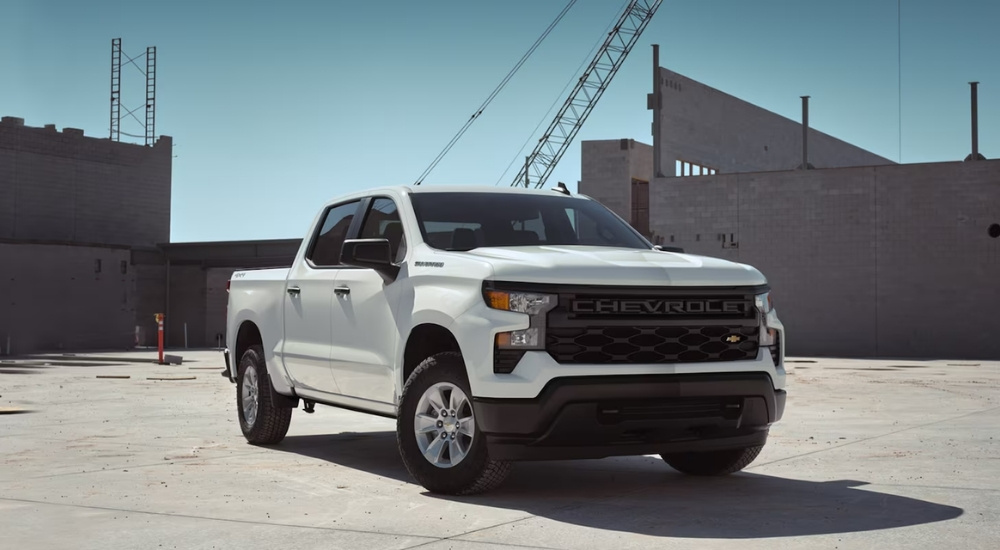 A white 2024 Chevy Silverado 1500 WT is shown parked after viewing a Chevy Silverado for sale near Booneville, MS.