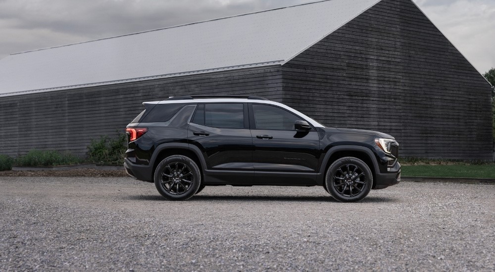 A black 2025 GMC Terrain for sale near Booneville from the side.
