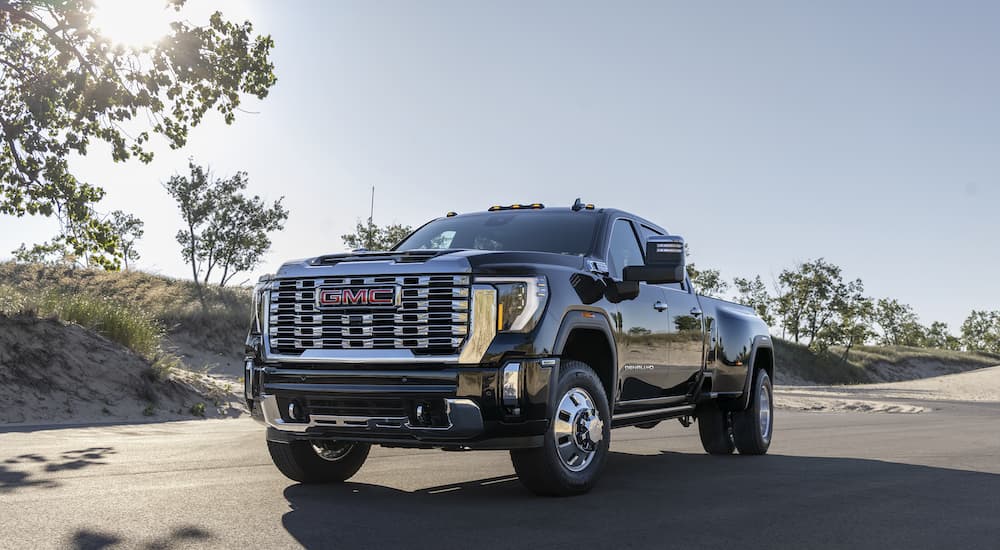 A black 2025 GMC Sierra 3500 Denali from the front at an angle.