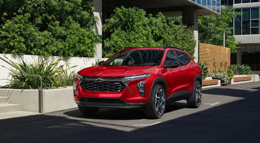 Red 2026 Chevy Trax RS parked on the side of a street