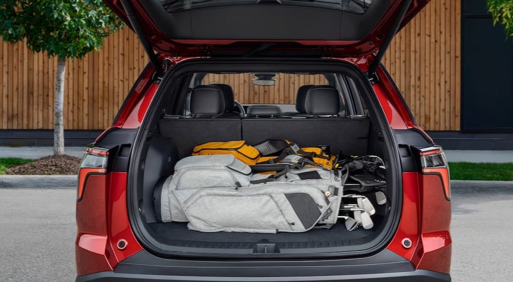Rear cargo area in a red 2026 Chevy Equinox RS.
