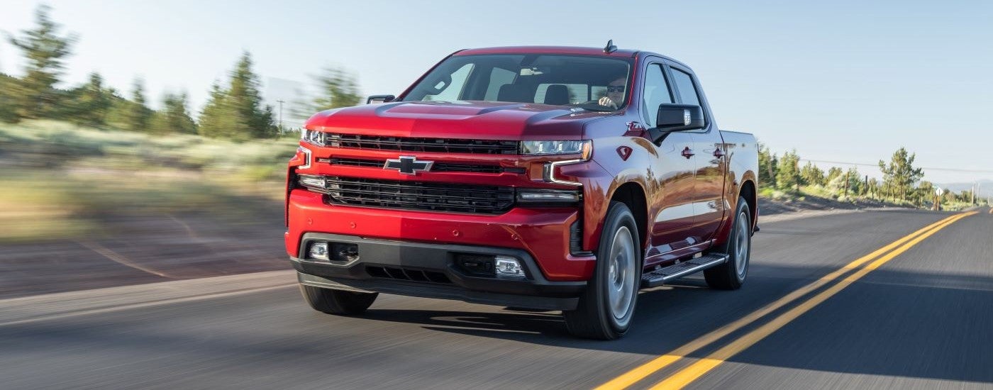 Red 2020 Chevy Silverado 1500 Z71 driving down the road