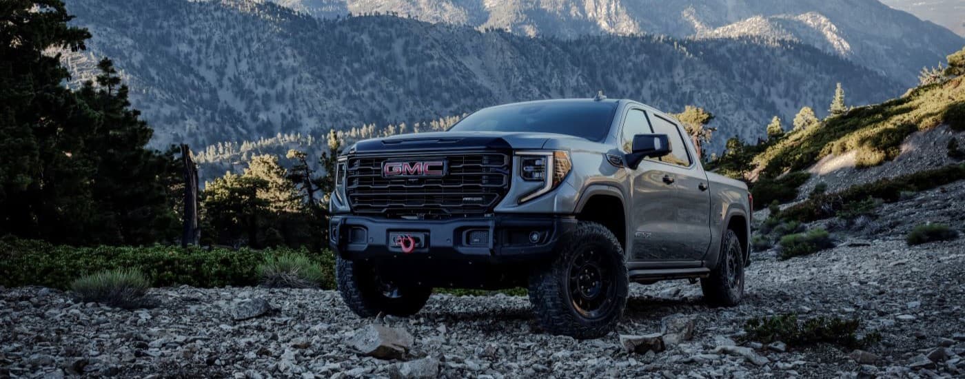 A grey 2023 GMC Sierra 1500 AT4x AEV is shown from the front at an angle.
