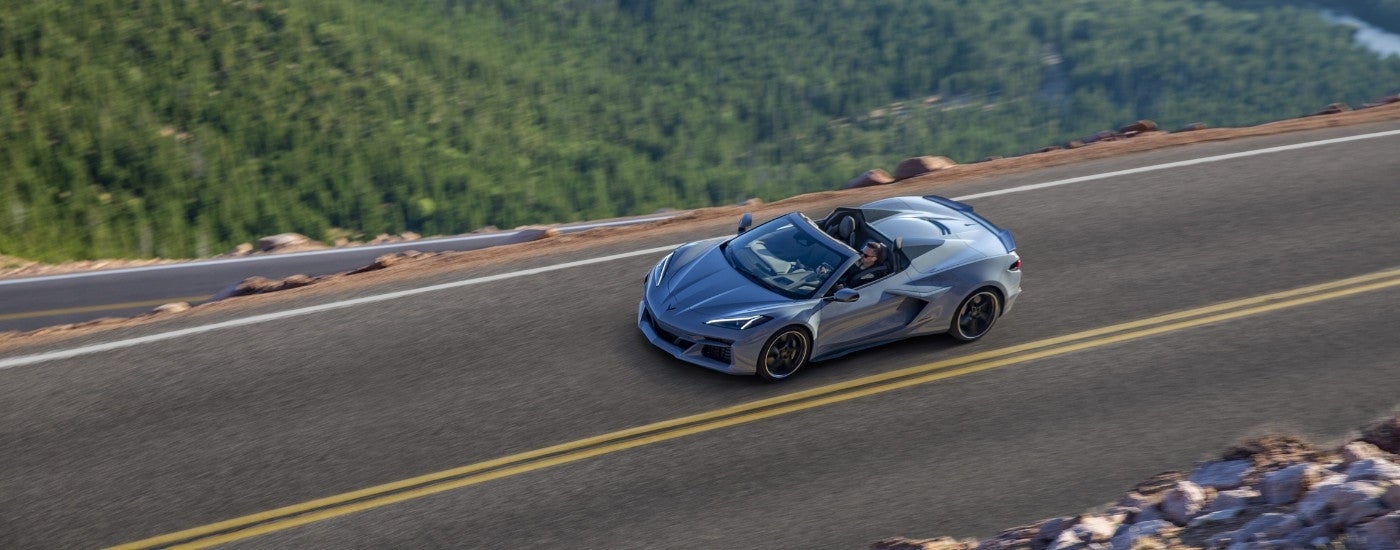 A silver 2024 Chevy Corvette E-Ray from a high angle after leaving a Chevy dealer near Tupelo.