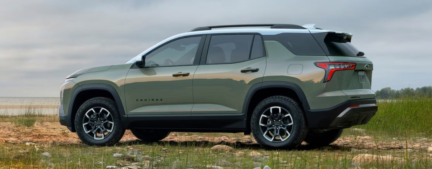 A green 2026 Chevy Equinox from the side.