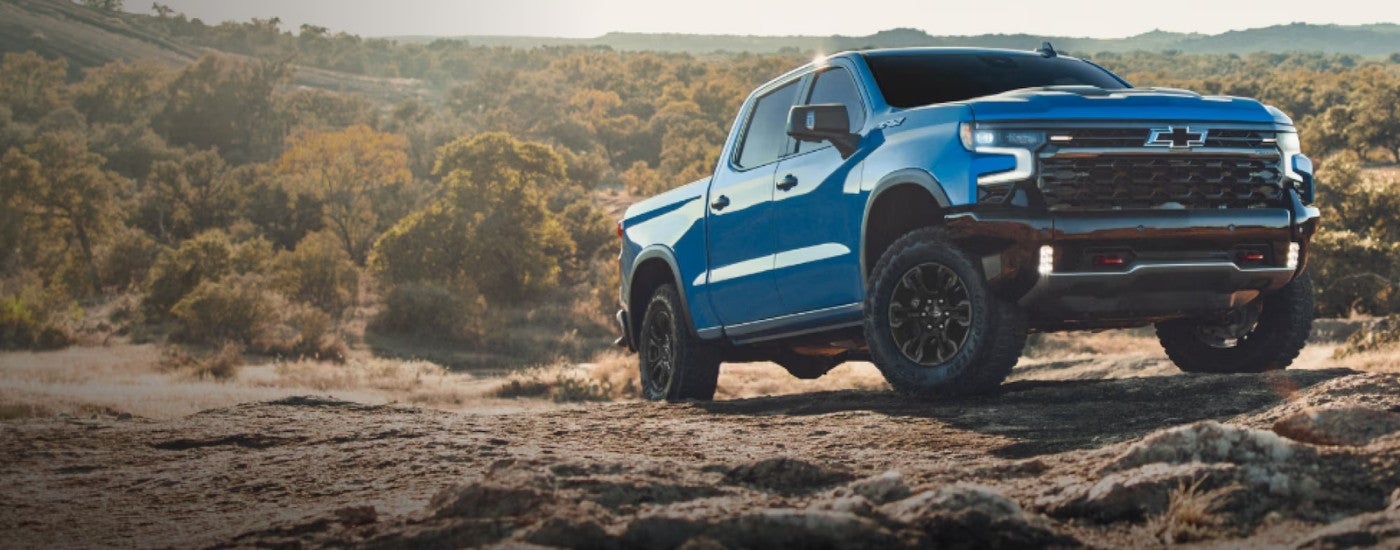 Blue 2026 Chevy Silverado 1500 ZR2 parked off-road