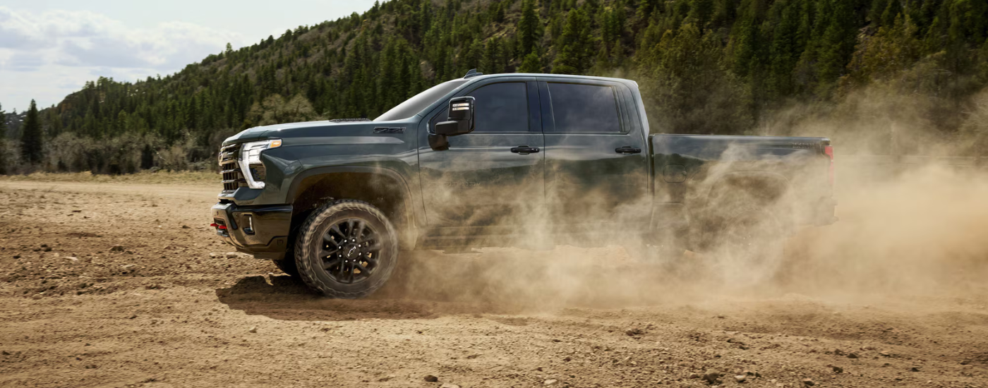 Green 2026 Chevy Silverado 2500 HD ZR2 drifting off-road