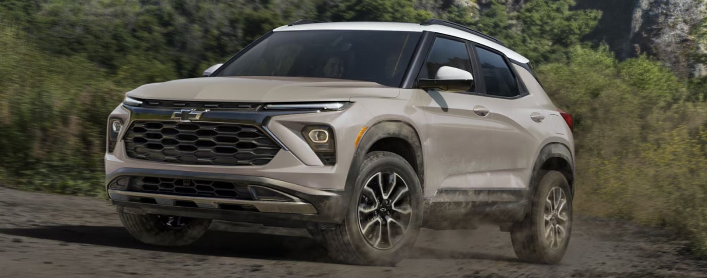 Tan 2026 Chevy Trailblazer driving off-road.