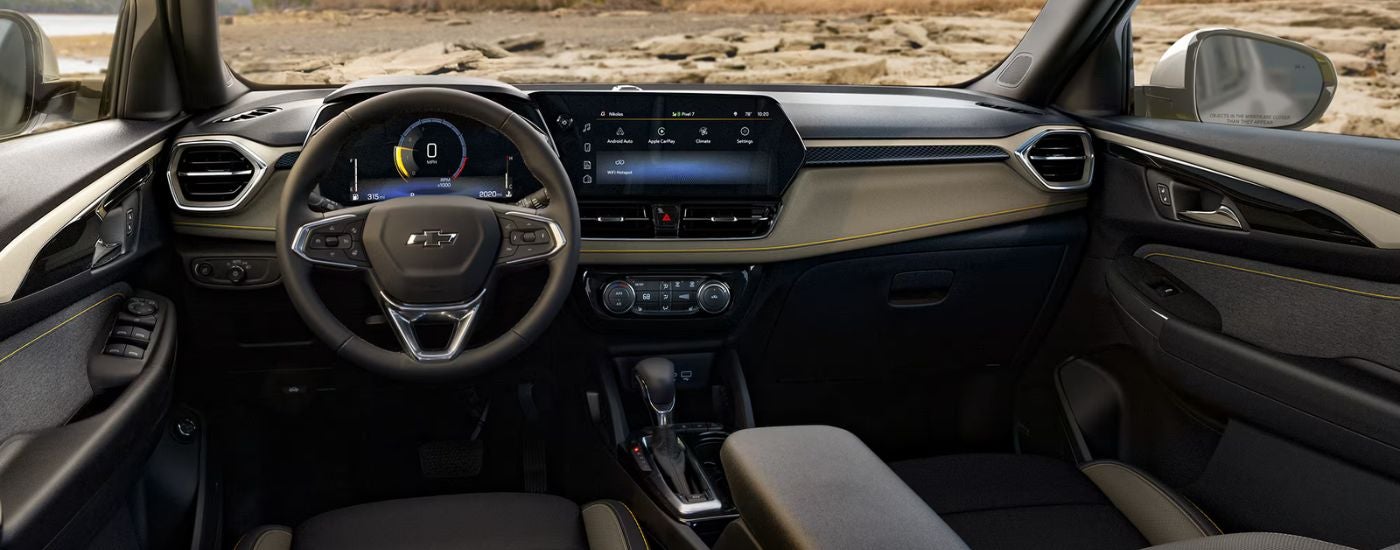 2026 Chevy Trailblazer front interior showing the steering wheel and infotainment.