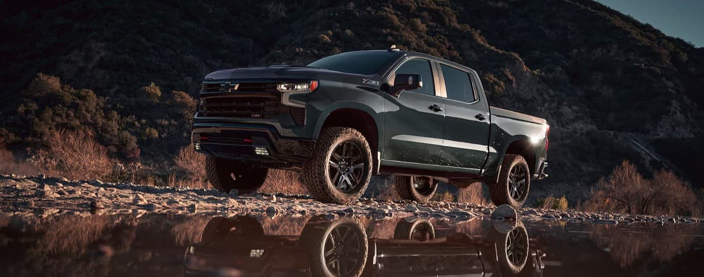 A green 2025 Chevy Silverado 1500 Z71 parked off-road.