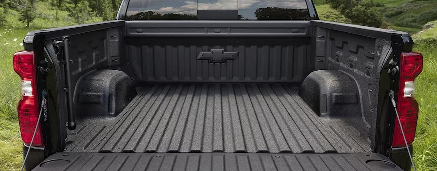 The bed of a black 2023 Chevy Silverado 1500 Custom is shown.