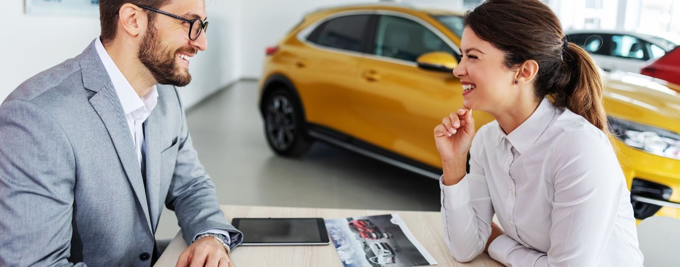 A customer and salesperson are shown during a GM lease turn in.