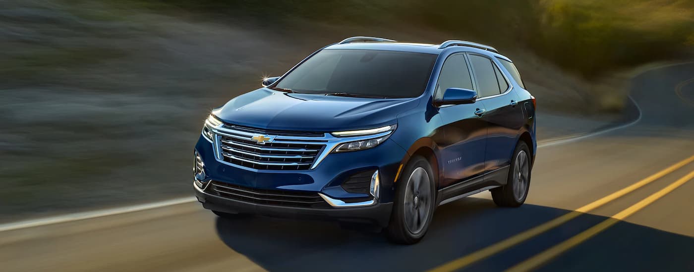 A blue 2022 Chevy Equinox driving to a Selmer used Chevy dealer.